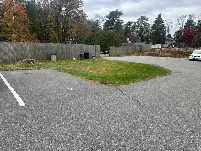 a swimming pool with wooden fence
