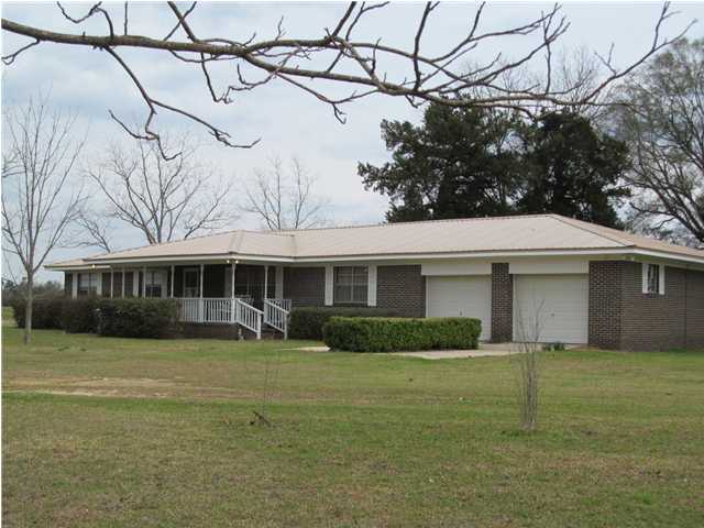 545 Richardson Road DeFuniak Springs, FL 32433 - Photo 1 of 22 a view of a yard in front of a house