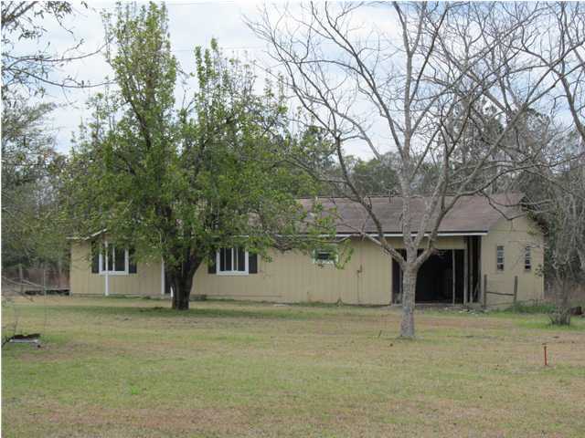 545 Richardson Road DeFuniak Springs, FL 32433 - Photo 18 of 22 a view of a large house with a tree