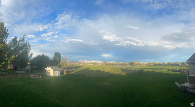 3145 South 500 West Vernal, UT 84078 - Photo 12 of 64 View of yard with a shed and a fire pit