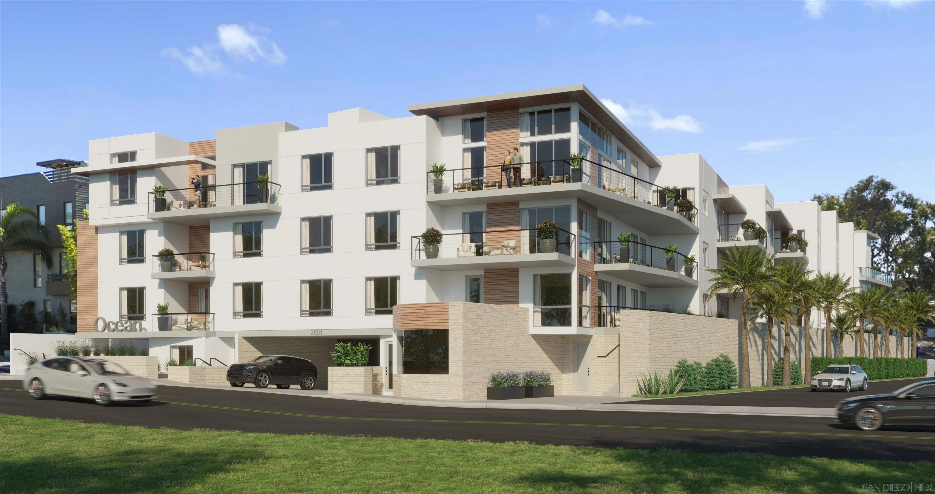 a front view of a residential apartment building with a yard