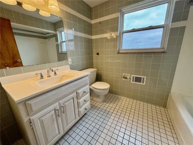 a bathroom with a bathtub and shower