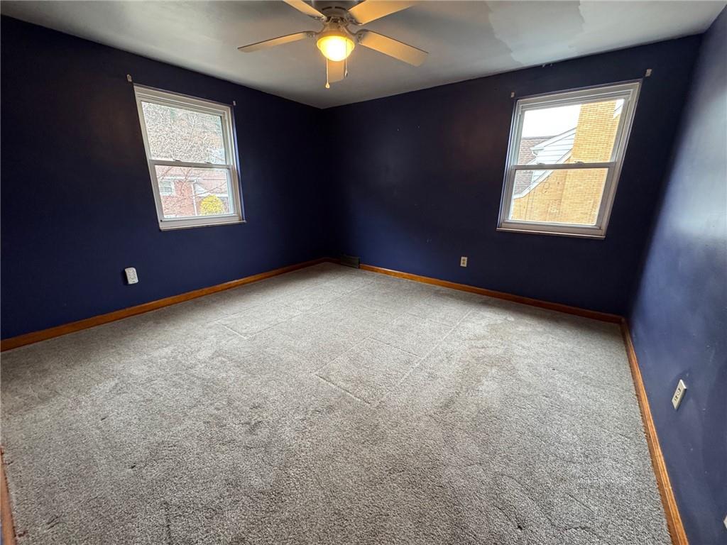 414 Marion Street Creighton, PA 15030 - Photo 9 of 23 an empty room with windows and fan
