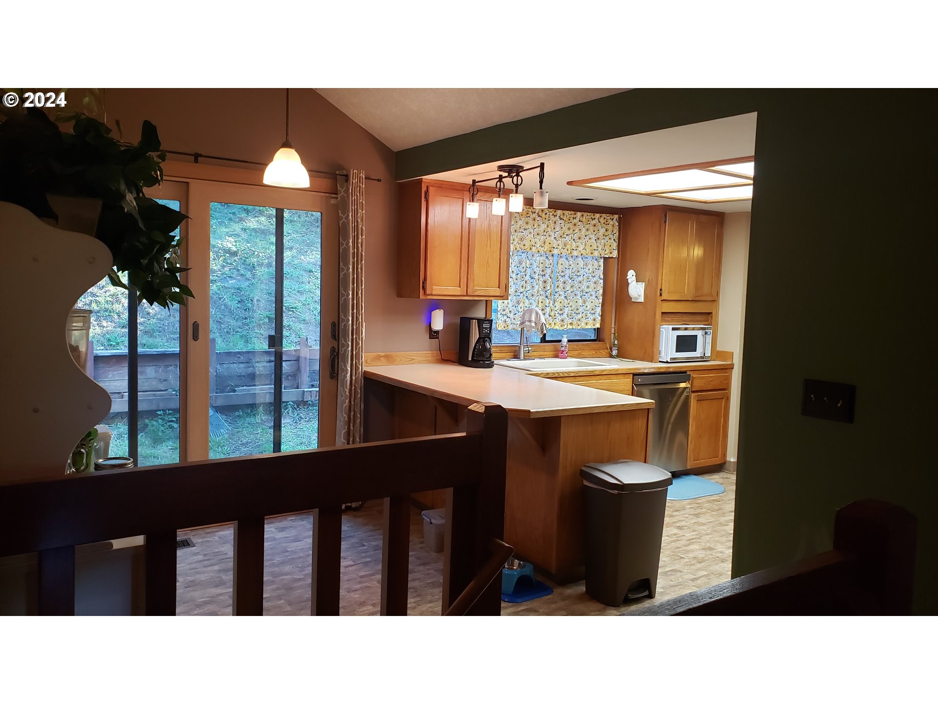 1442 Southwest Wallula Drive Gresham, OR 97080 - Photo 11 of 24 a open kitchen with a table and chairs