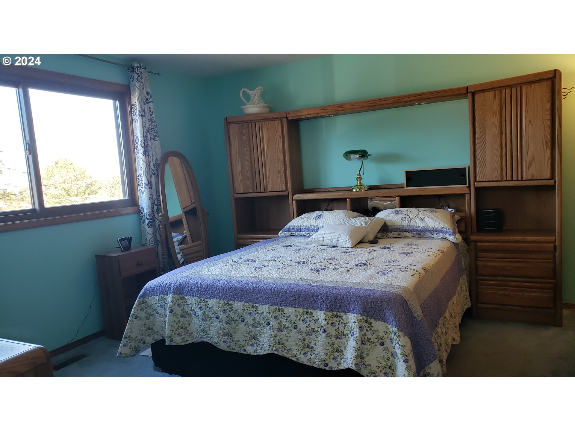 1442 Southwest Wallula Drive Gresham, OR 97080 - Photo 16 of 24 a bedroom with a bed a window and dresser