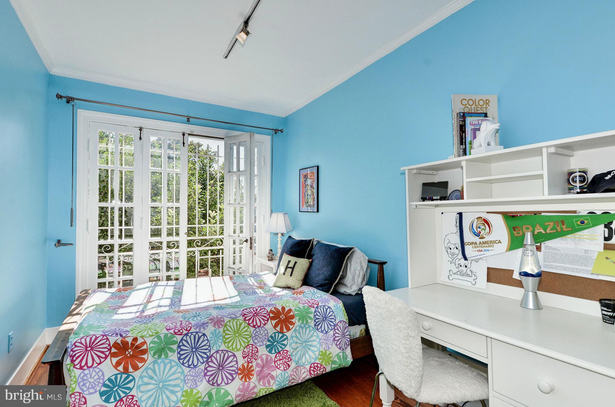 3316 Reservoir Road Northwest Washington, DC 20007 - Photo 12 of 19 a bedroom with a bed and a table