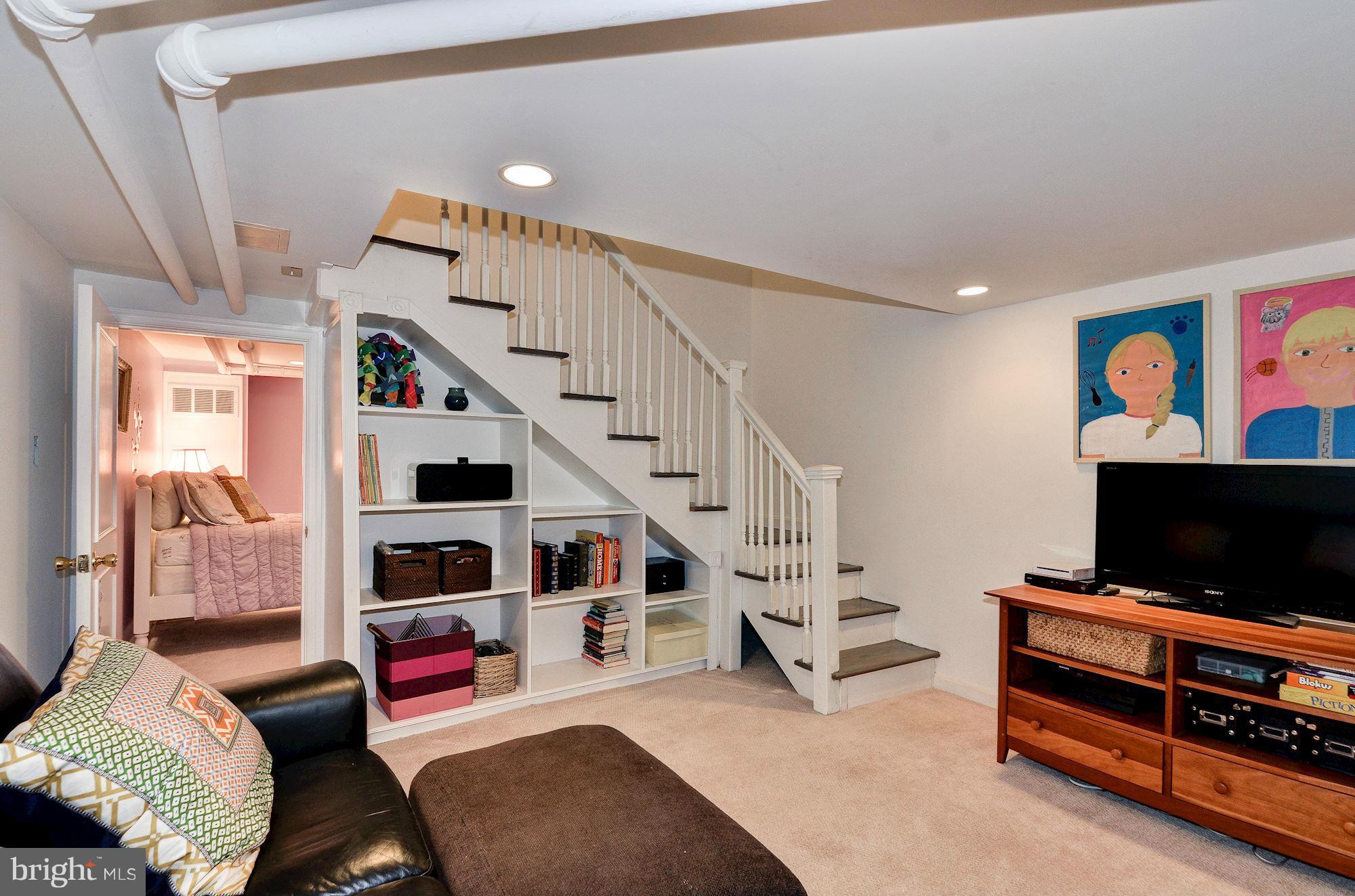 3316 Reservoir Road Northwest Washington, DC 20007 - Photo 14 of 19 a living room with furniture and a flat screen tv