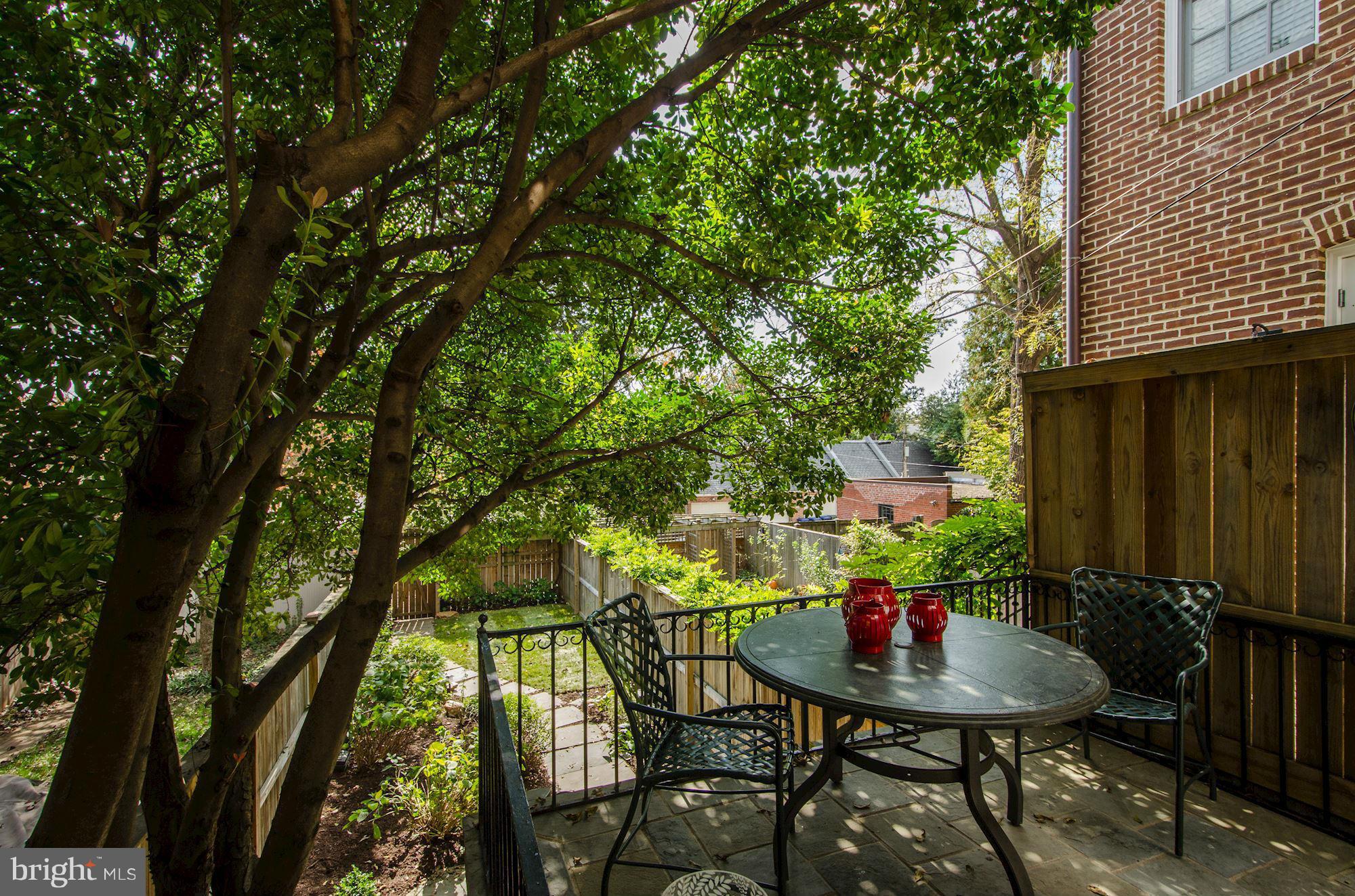 3316 Reservoir Road Northwest Washington, DC 20007 - Photo 17 of 19 a backyard of a house with table and chairs