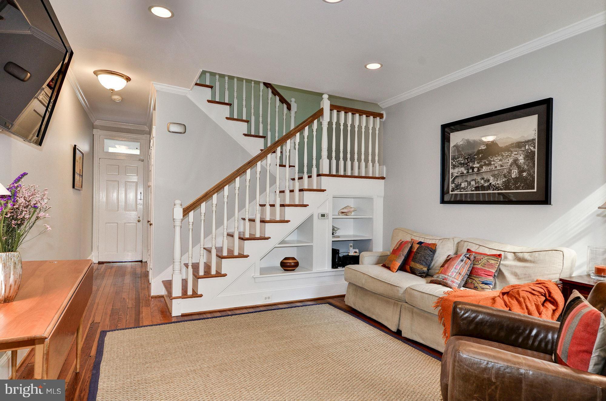 3316 Reservoir Road Northwest Washington, DC 20007 - Photo 3 of 19 a living room with furniture and stairs