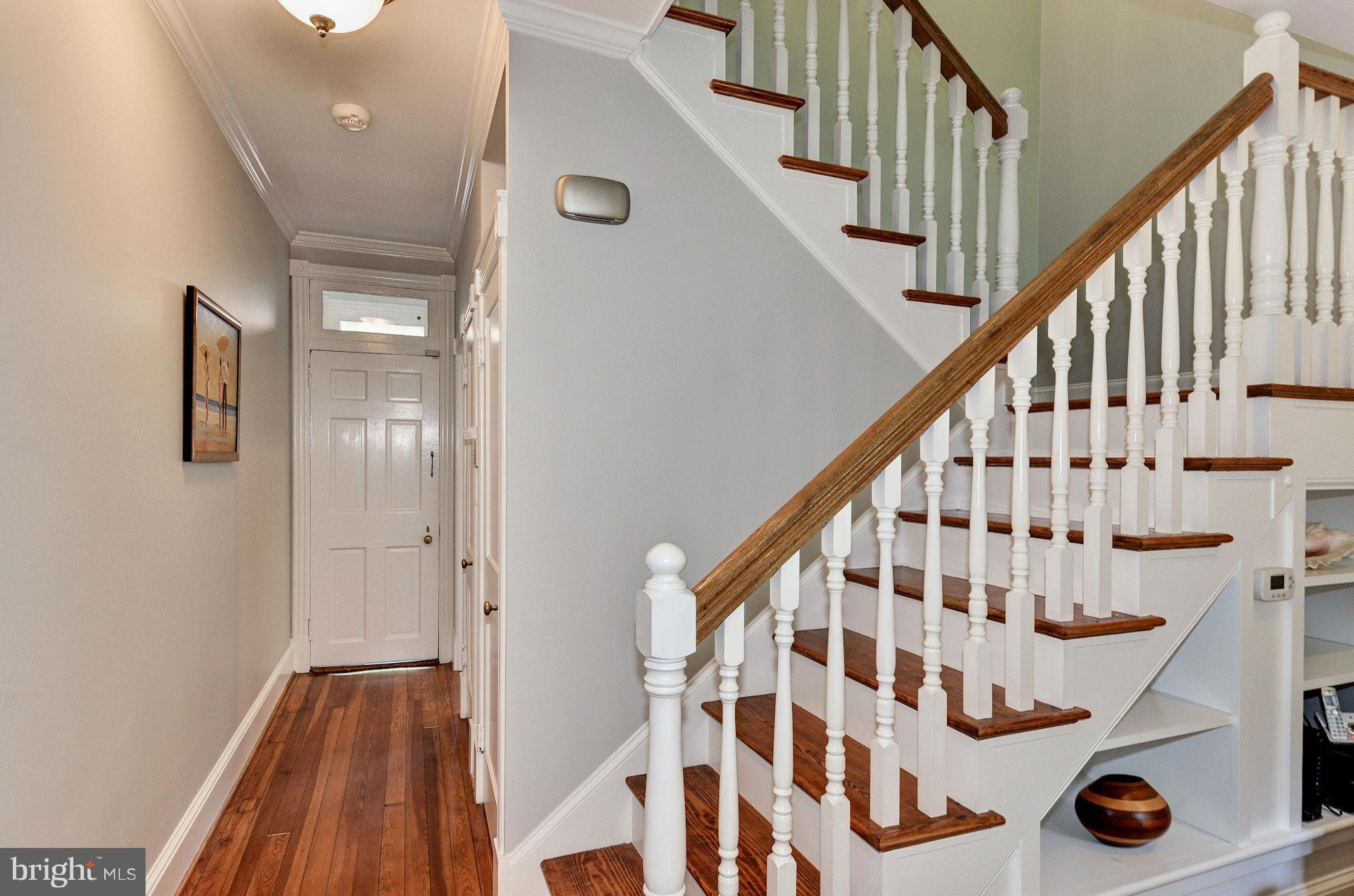 3316 Reservoir Road Northwest Washington, DC 20007 - Photo 8 of 19 a view of staircase with wooden floor and white walls