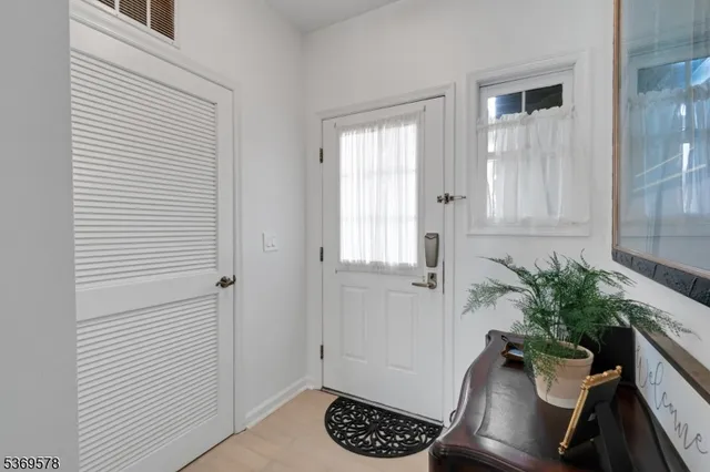 a view of entryway with wooden floor