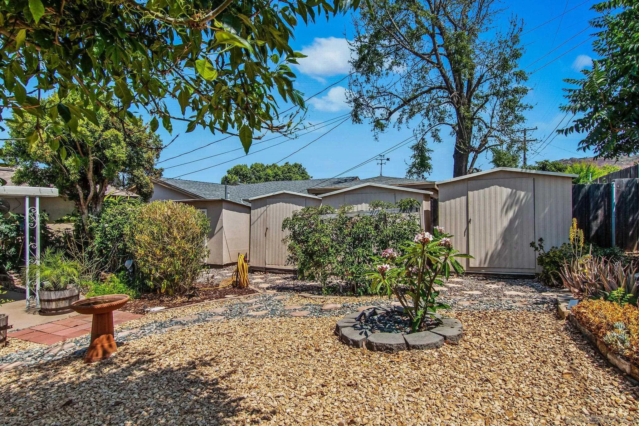1701 Pepper Villa Drive El Cajon, CA 92021 - Photo 13 of 23 a front view of a house with a yard