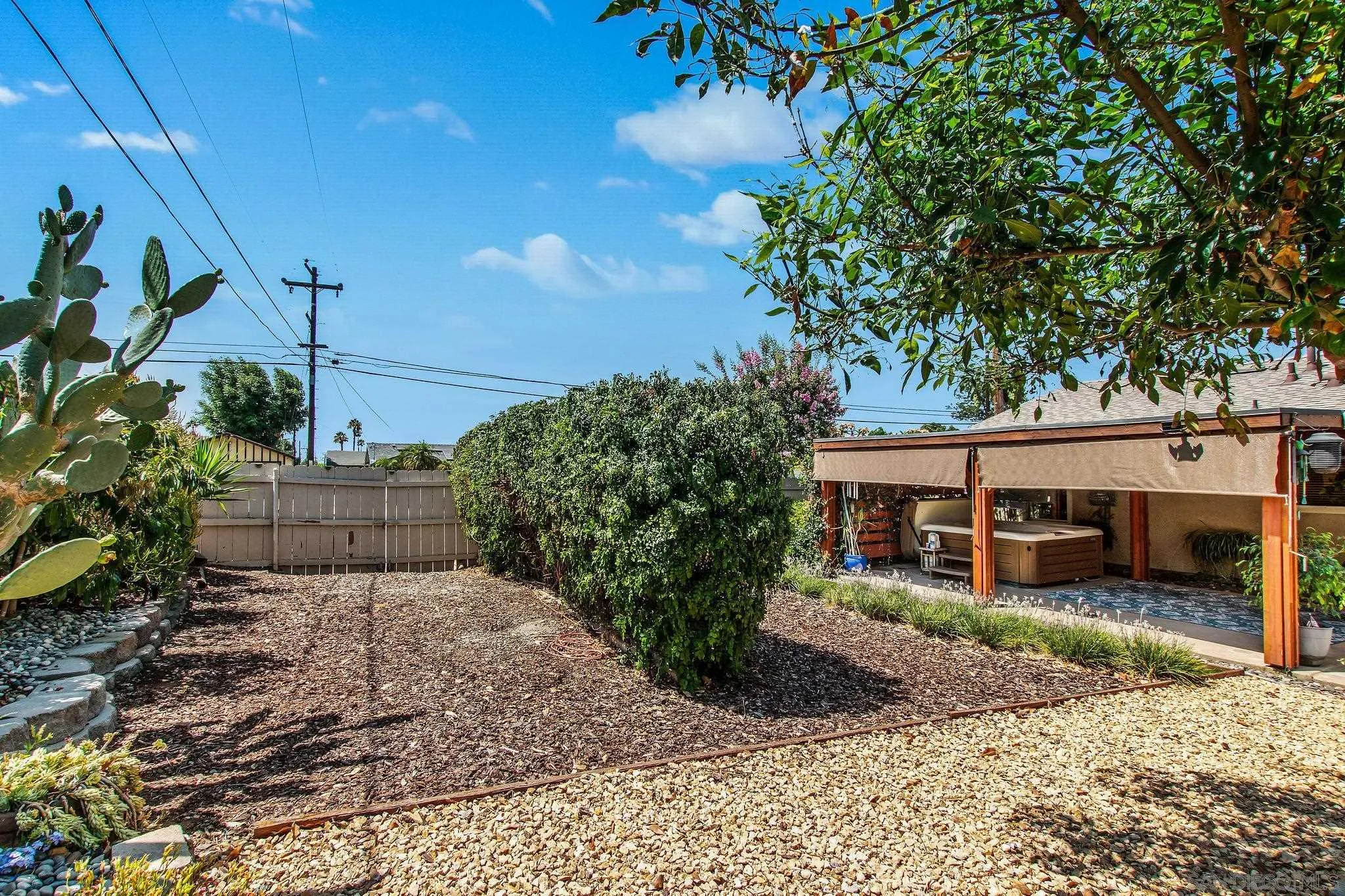 1701 Pepper Villa Drive El Cajon, CA 92021 - Photo 14 of 23 a view of a house with a yard and potted plants