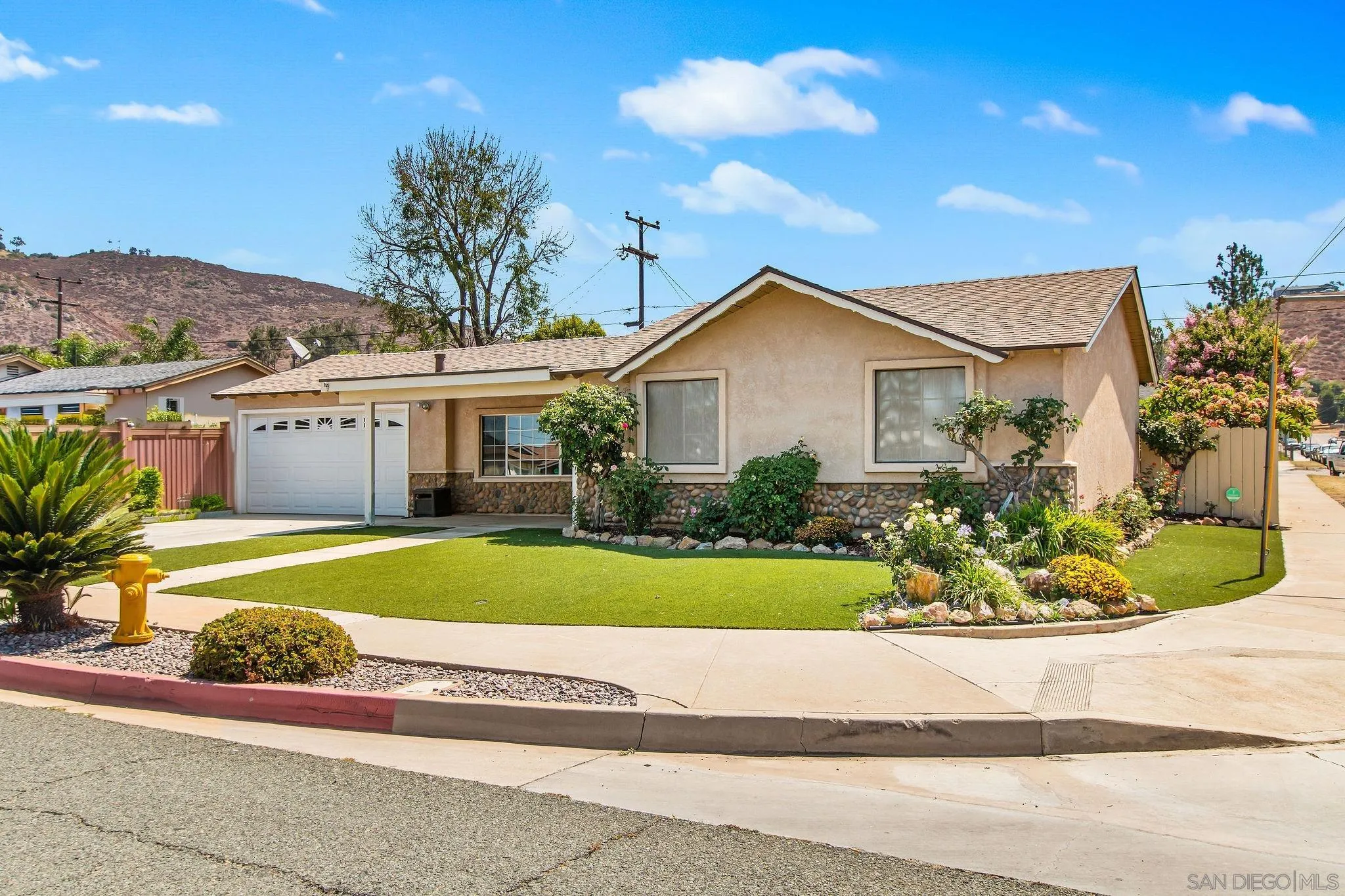 1701 Pepper Villa Drive El Cajon, CA 92021 - Photo 21 of 23 a front view of a house with a garden and porch