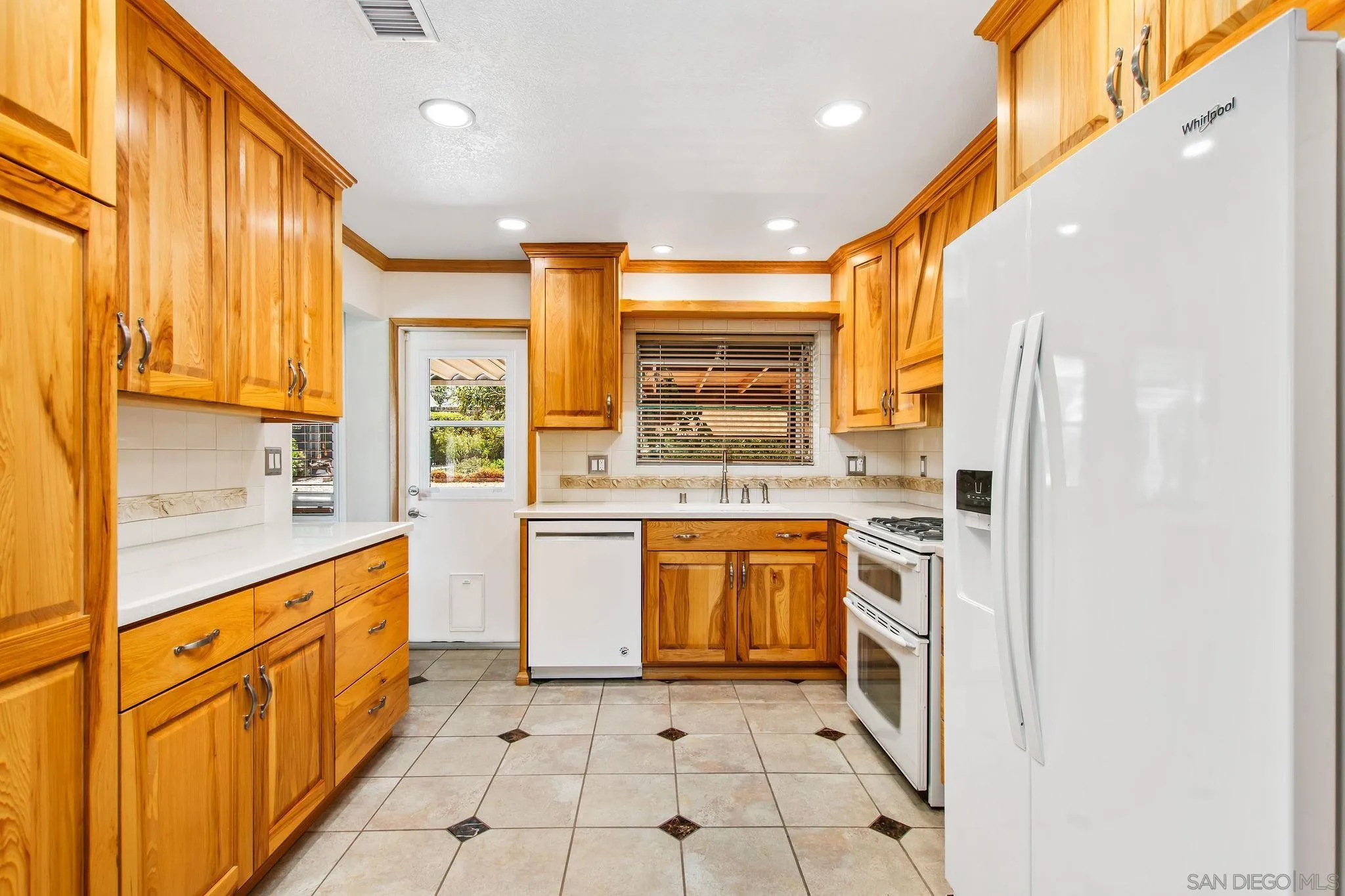 1701 Pepper Villa Drive El Cajon, CA 92021 - Photo 4 of 23 a large kitchen with stainless steel appliances a stove a sink and a refrigerator