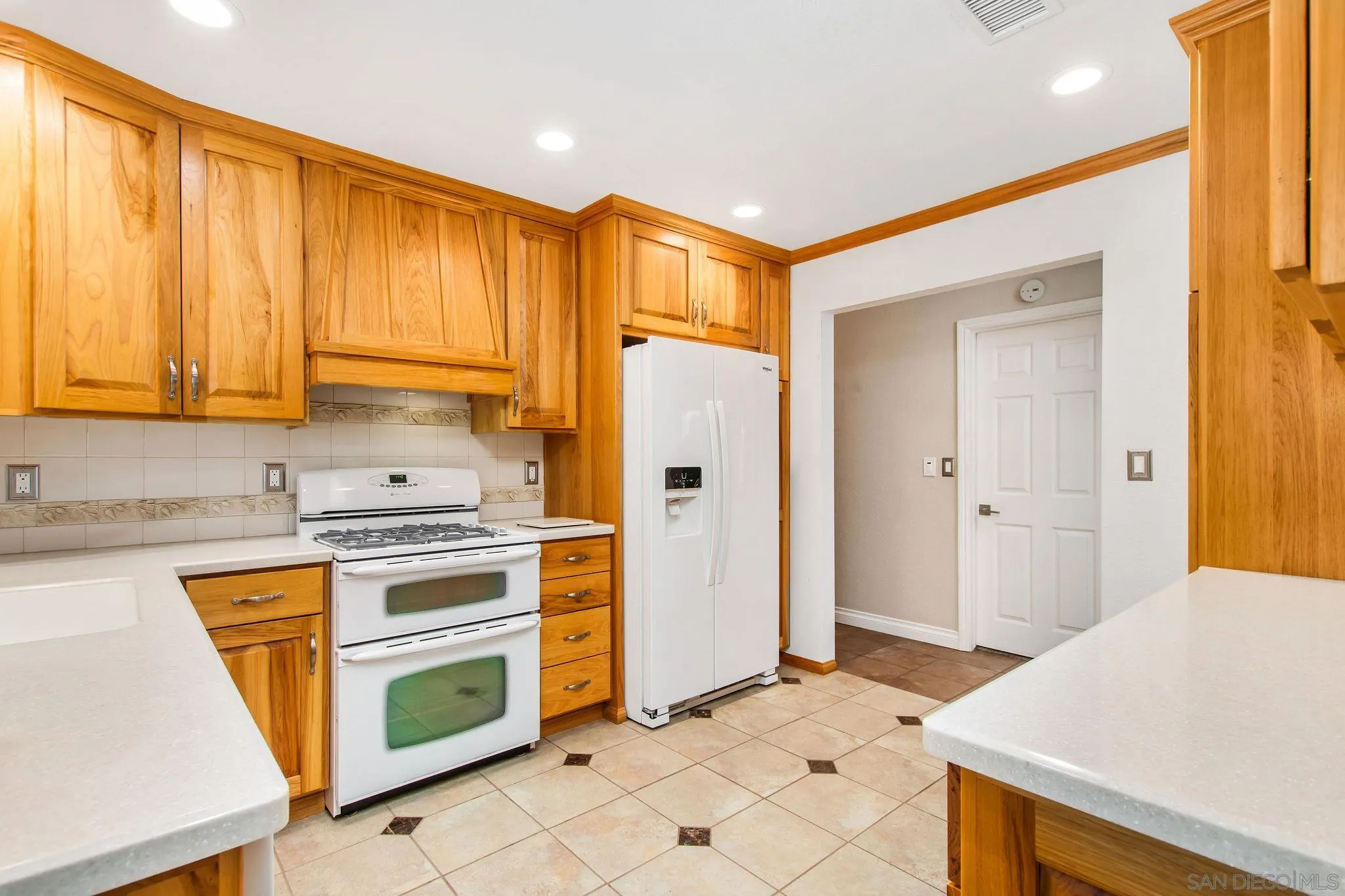 1701 Pepper Villa Drive El Cajon, CA 92021 - Photo 5 of 23 a kitchen with stainless steel appliances a stove a refrigerator and cabinets