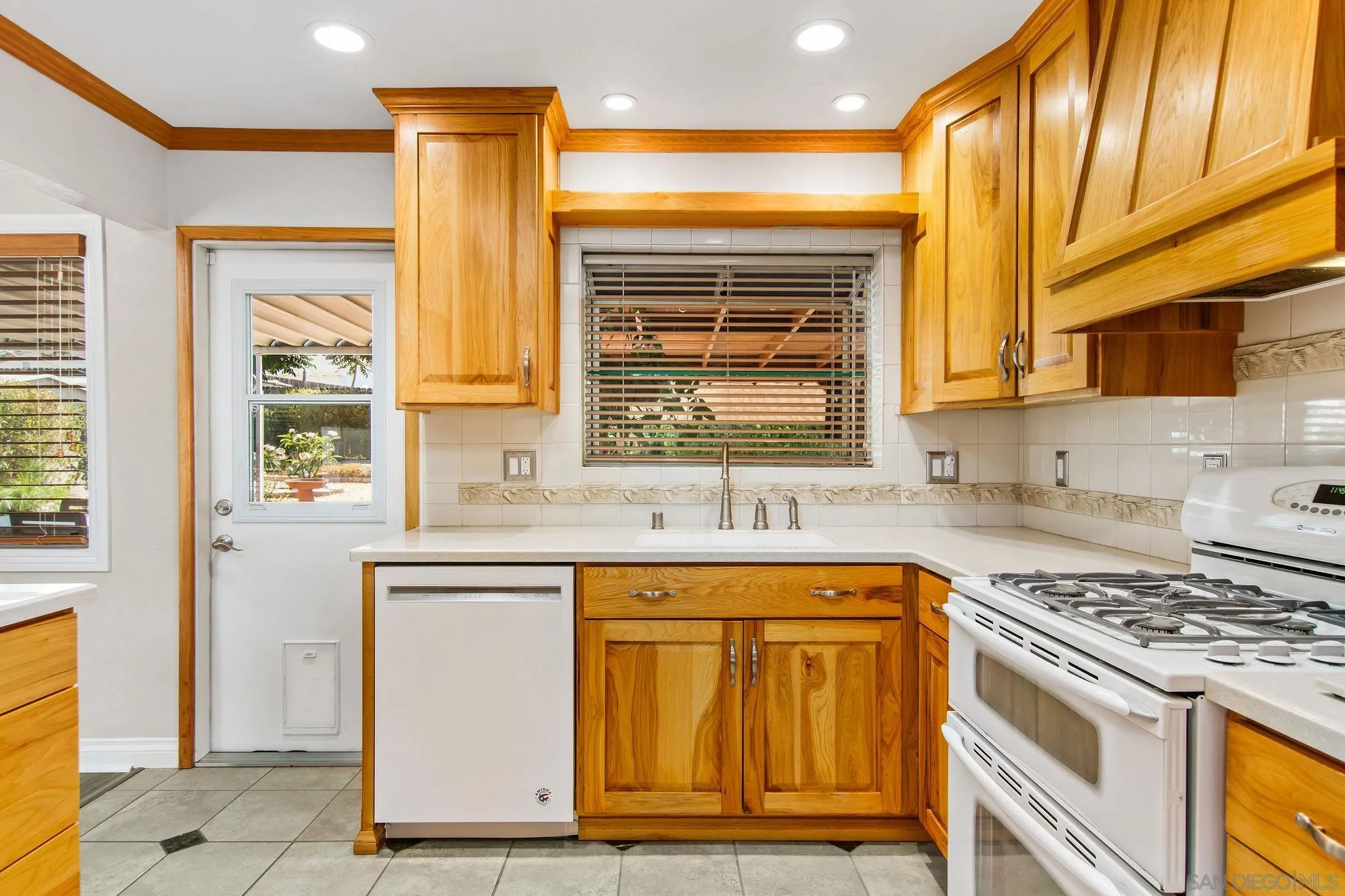 1701 Pepper Villa Drive El Cajon, CA 92021 - Photo 6 of 23 a kitchen with stainless steel appliances granite countertop a stove and a refrigerator