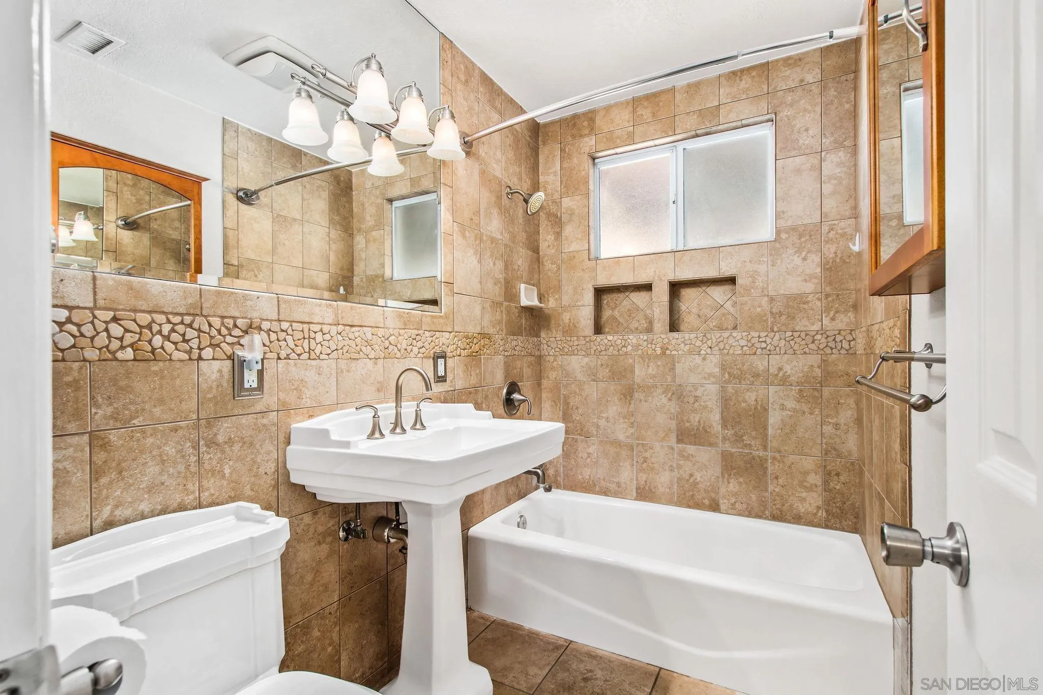 1701 Pepper Villa Drive El Cajon, CA 92021 - Photo 8 of 23 a bathroom with a sink a toilet a mirror and shower