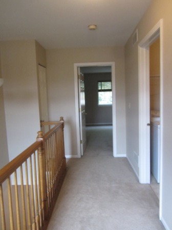 17794 Braewick Road Gurnee, IL 60031 - Photo 17 of 18 a view of a hallway view with wooden floor and staircase