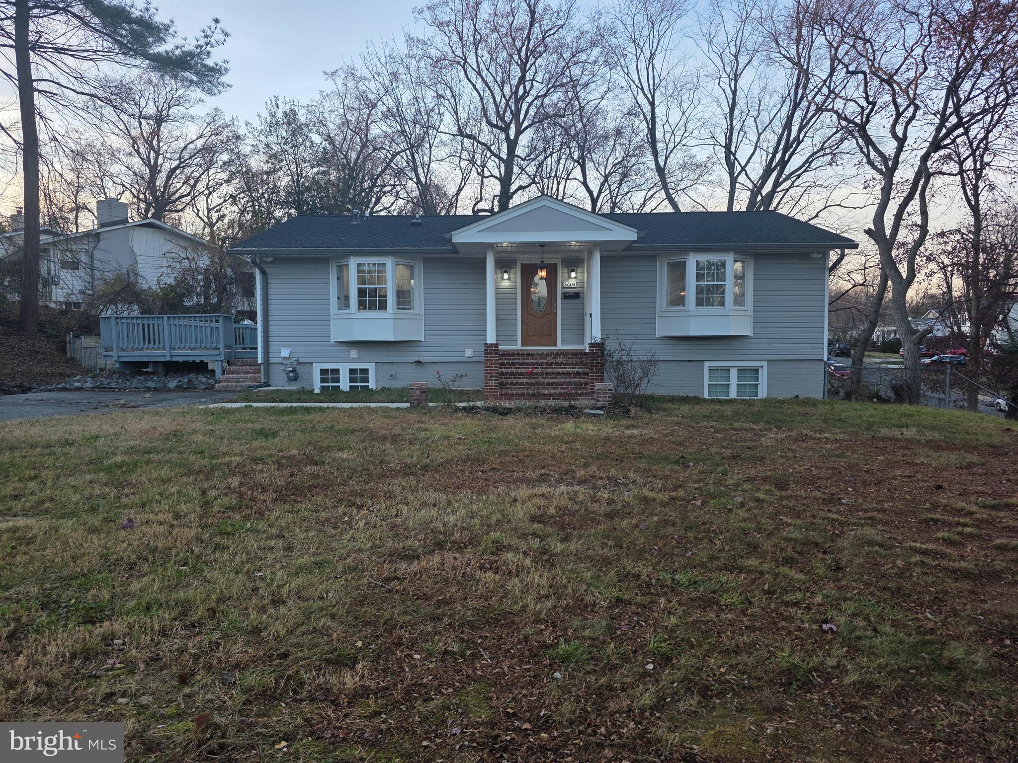 a view of a house with a yard