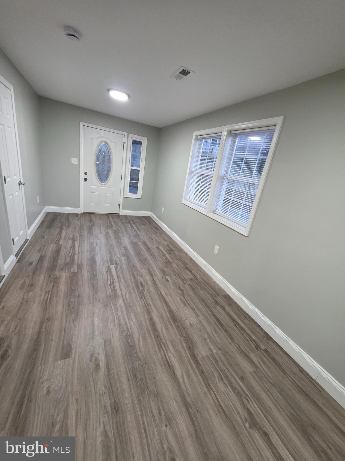 3604 Lakota Road Alexandria, VA 22303 - Photo 19 of 25 an empty room with wooden floor and windows