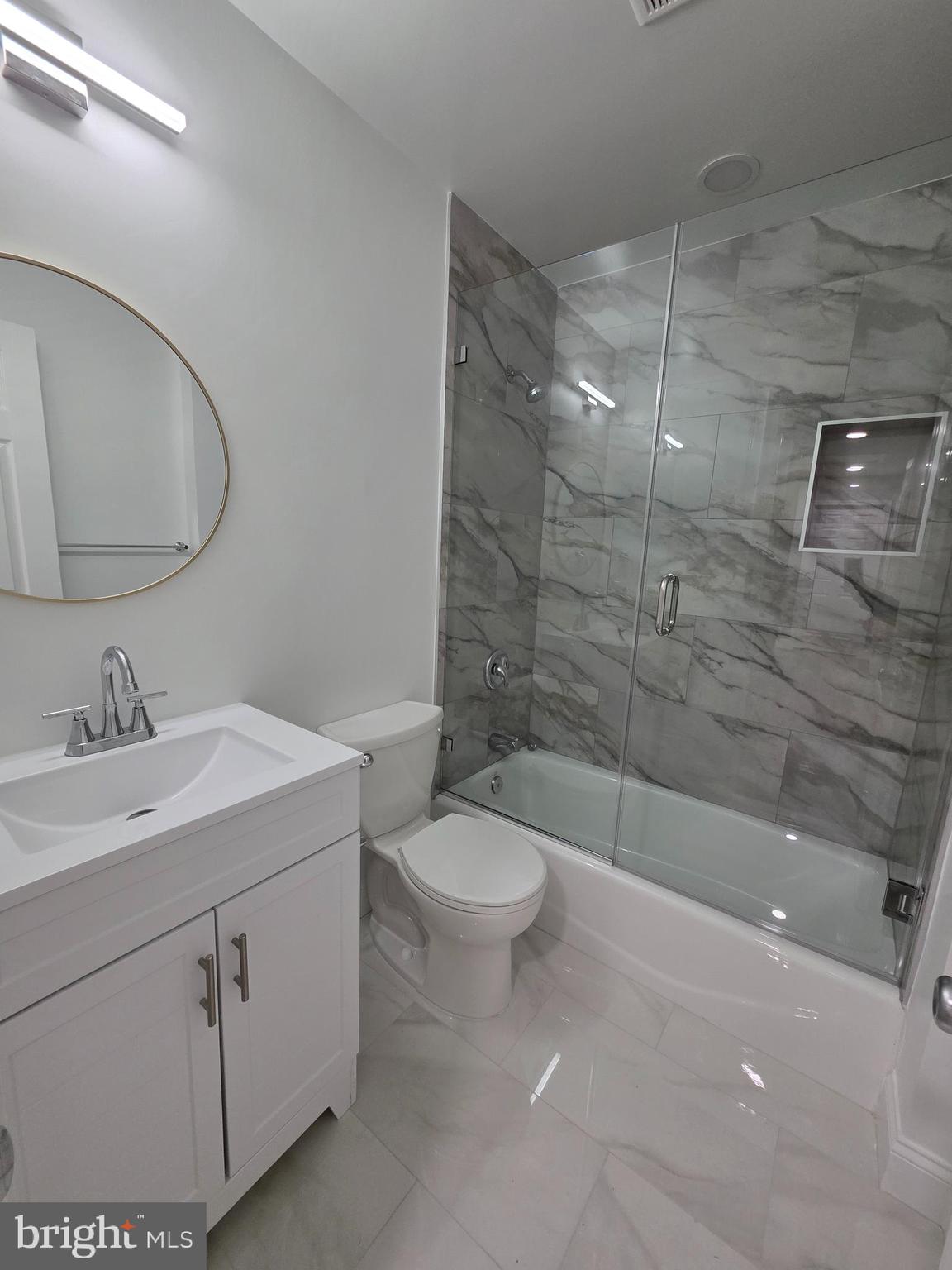 3604 Lakota Road Alexandria, VA 22303 - Photo 6 of 25 a bathroom with a sink a toilet and shower