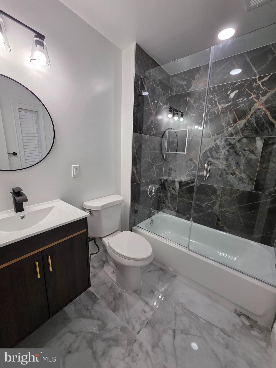 3604 Lakota Road Alexandria, VA 22303 - Photo 8 of 25 a bathroom with a sink toilet and shower
