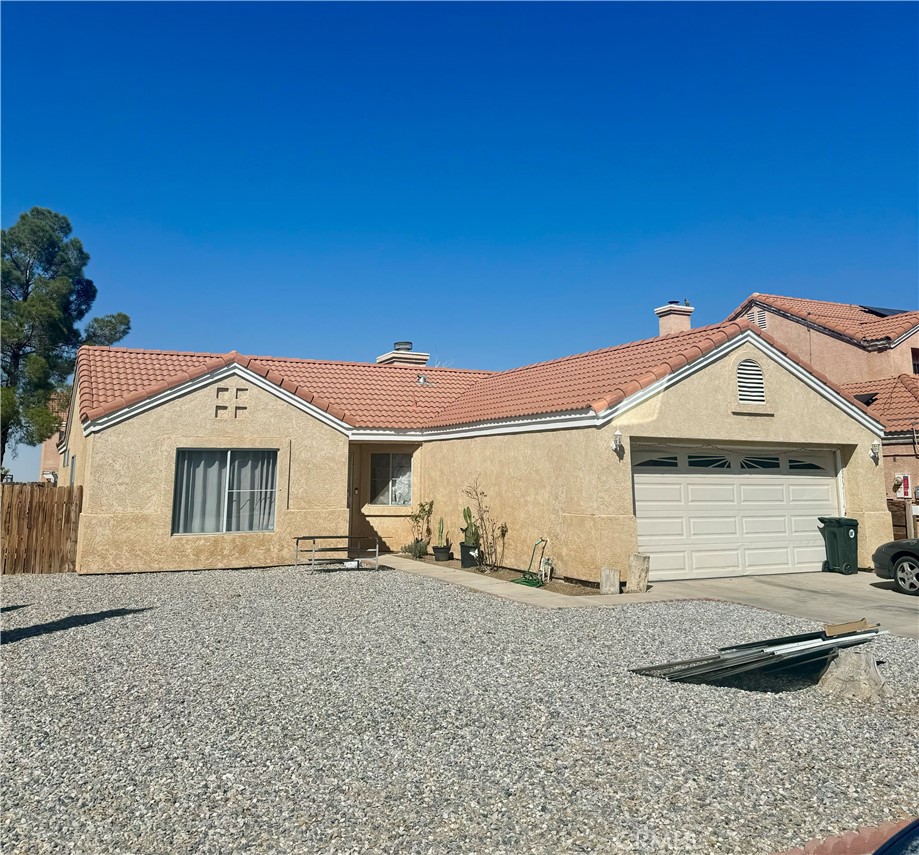 10460 Mendicino Road Adelanto, CA 92301 - Photo 1 of 1 a front view of a house with a yard