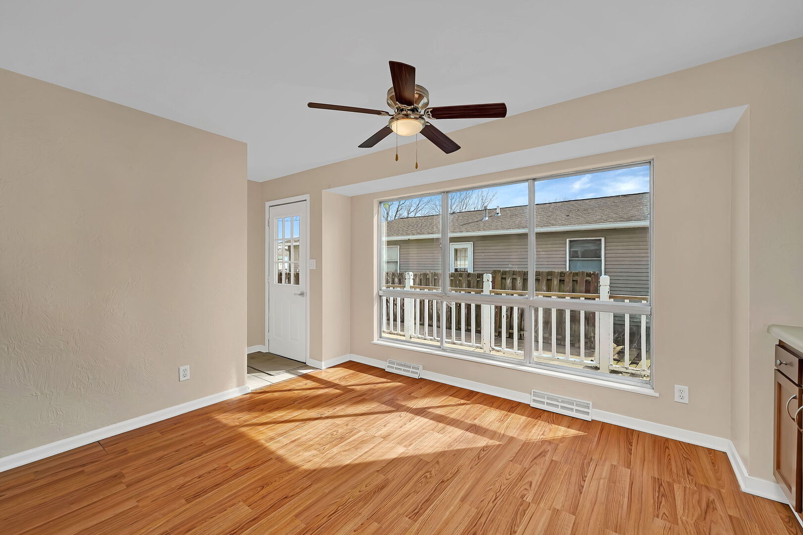 816 2nd Avenue Morris, IL 60450 - Photo 16 of 31 a view of a livingroom with wooden floor and a ceiling fan