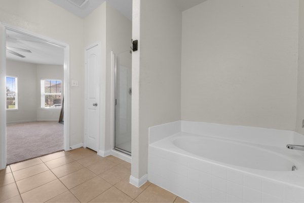 1327 Diamond Drape Drive Rosharon, TX 77583 - Photo 20 of 26 a white bath tub sitting in a spacious bathroom