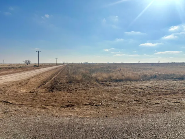 a view of ocean beach and mountain