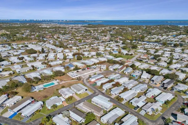 an aerial view of residential building with parking space