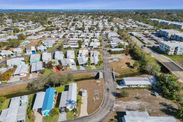 an aerial view of residential houses with outdoor space