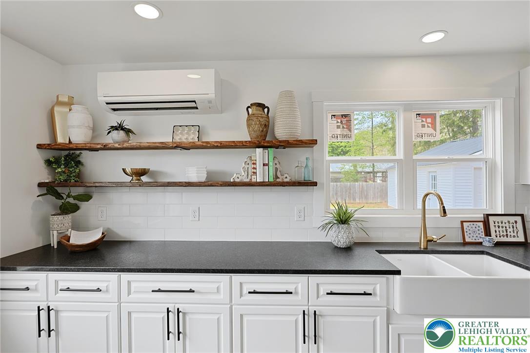 121 Ben Titus Road Tamaqua, PA 18252 - Photo 17 of 48 a kitchen with white cabinets a sink and a window