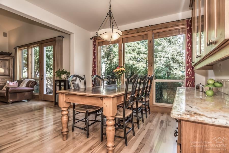 19505 Sugar Mill Loop Bend, OR 97702 - Photo 6 of 23 Dining area with floor to ceiling window