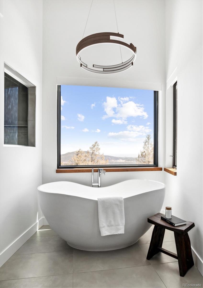 10199 Christopher Drive Conifer, CO 80433 - Photo 18 of 40 a view of a bathtub in a room