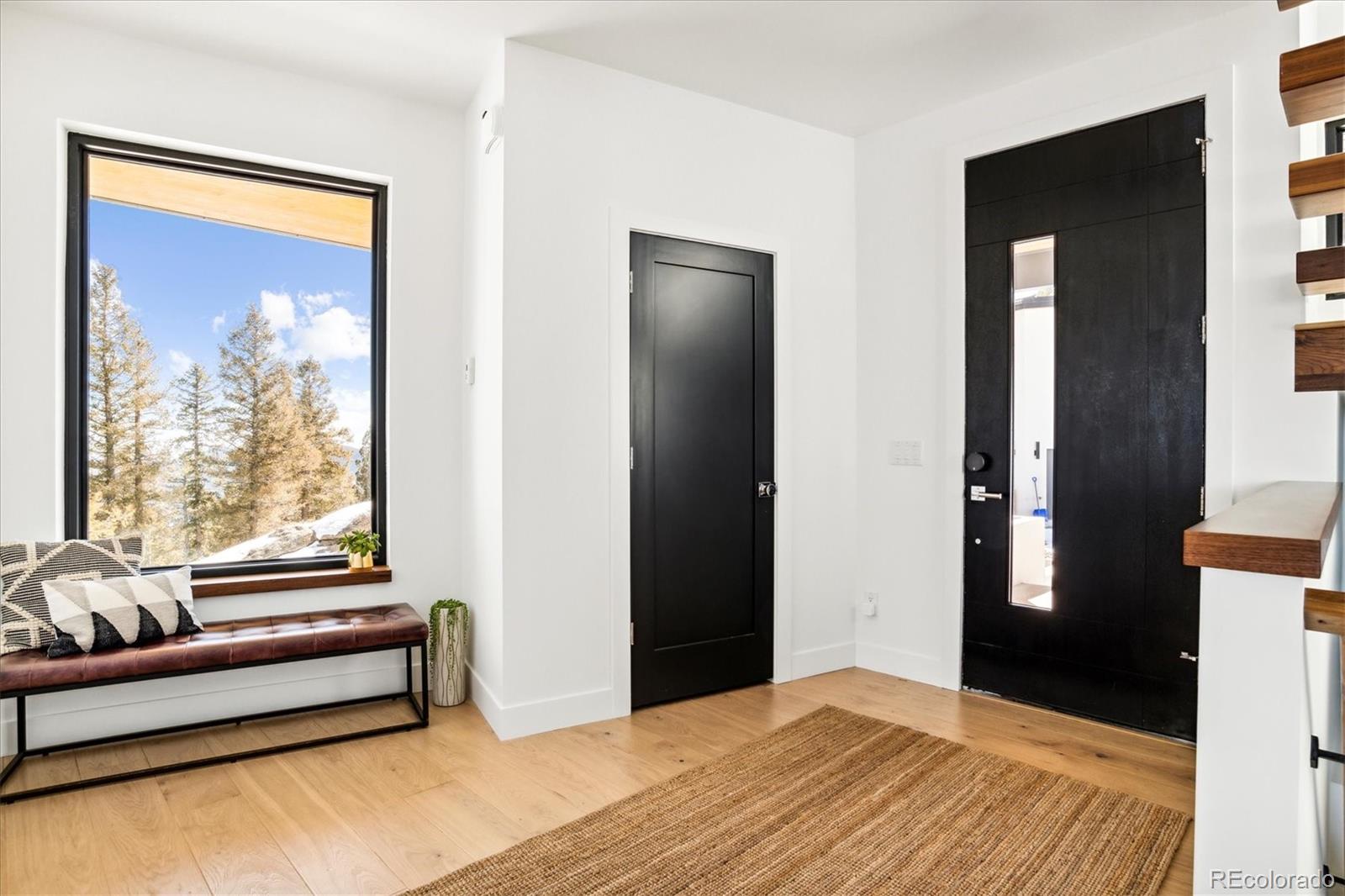 10199 Christopher Drive Conifer, CO 80433 - Photo 2 of 40 a spacious bedroom with a bed and a window