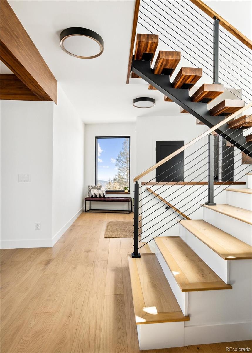10199 Christopher Drive Conifer, CO 80433 - Photo 23 of 40 a view of a living room and utility room
