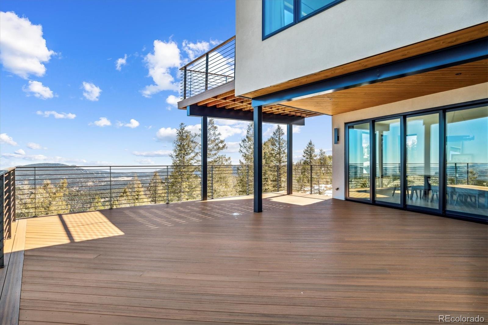 10199 Christopher Drive Conifer, CO 80433 - Photo 26 of 40 a view of an ocean with a floor to ceiling window