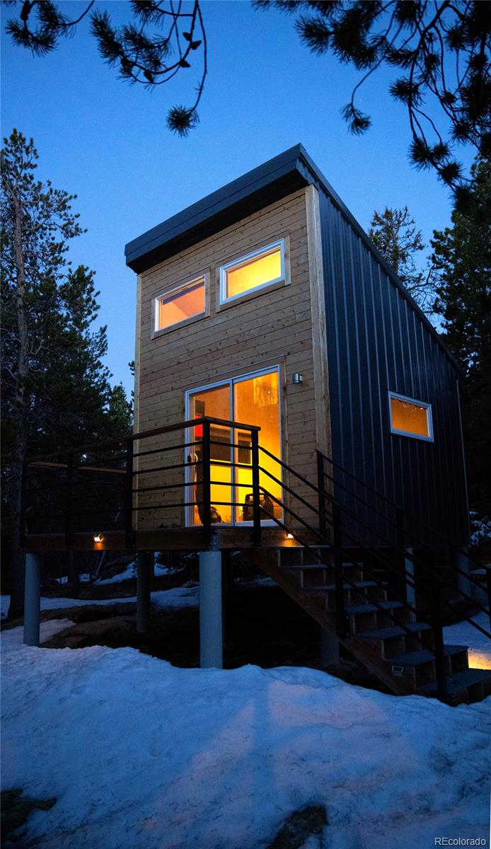 10199 Christopher Drive Conifer, CO 80433 - Photo 34 of 40 a view of a living room with a tv