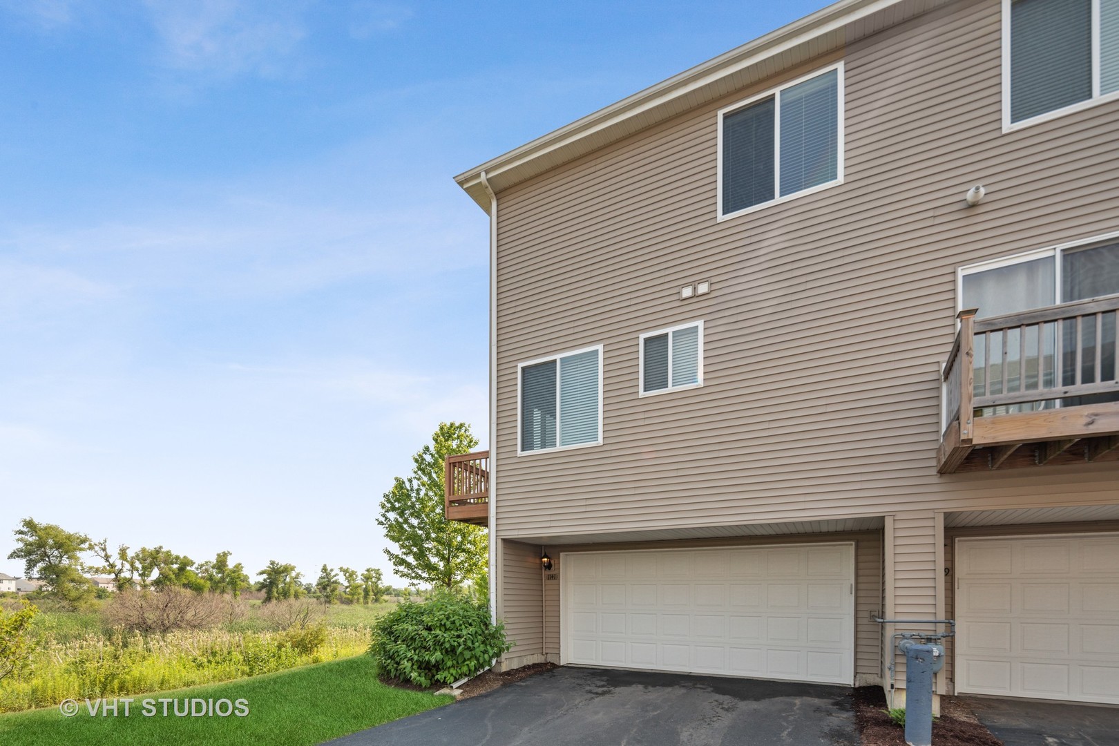 1141 Piccolo Lane Volo, IL 60073 - Photo 21 of 29 a front view of a house with a yard and garage