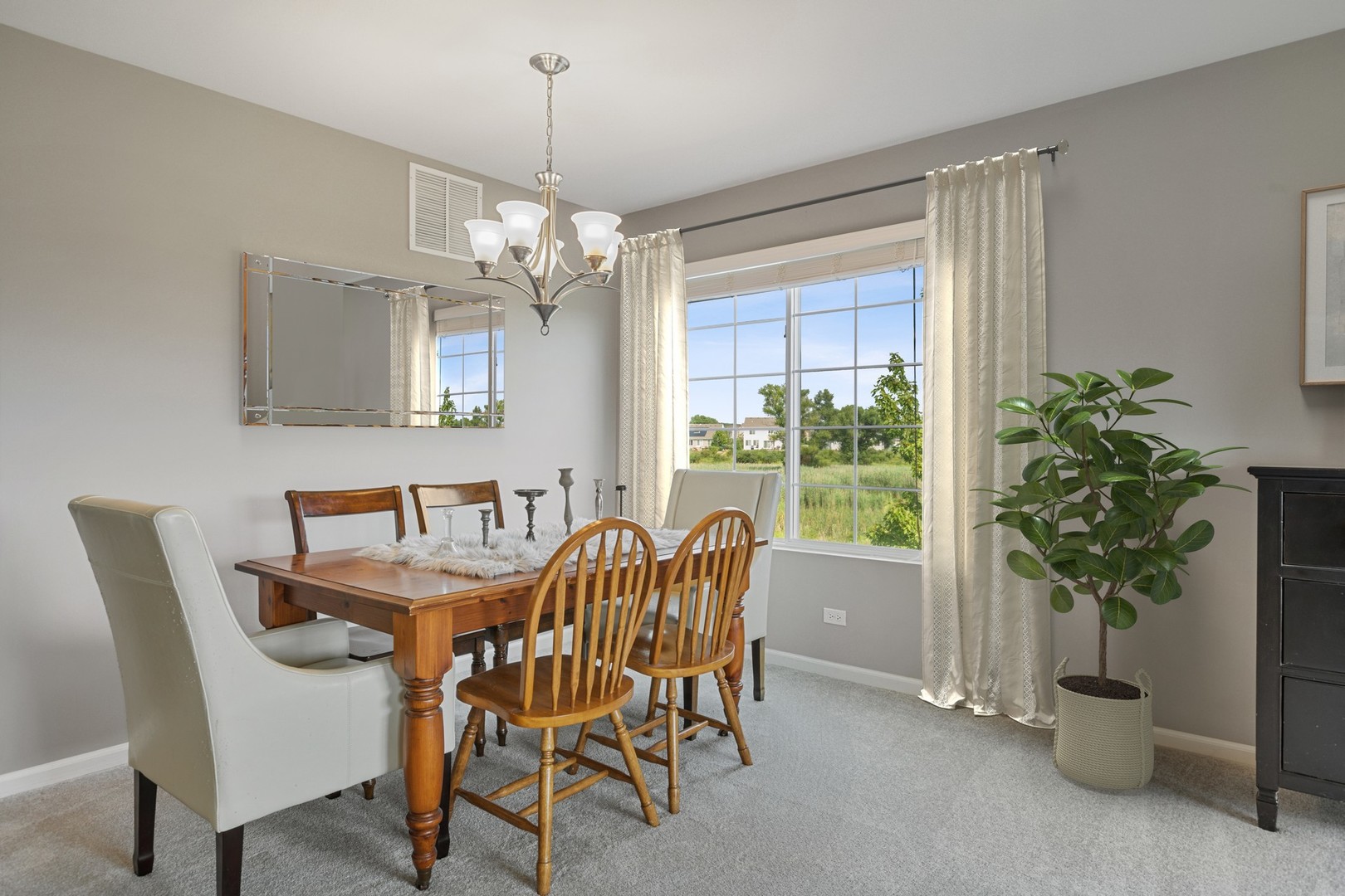1141 Piccolo Lane Volo, IL 60073 - Photo 4 of 29 a view of a dining room with furniture window and chandelier