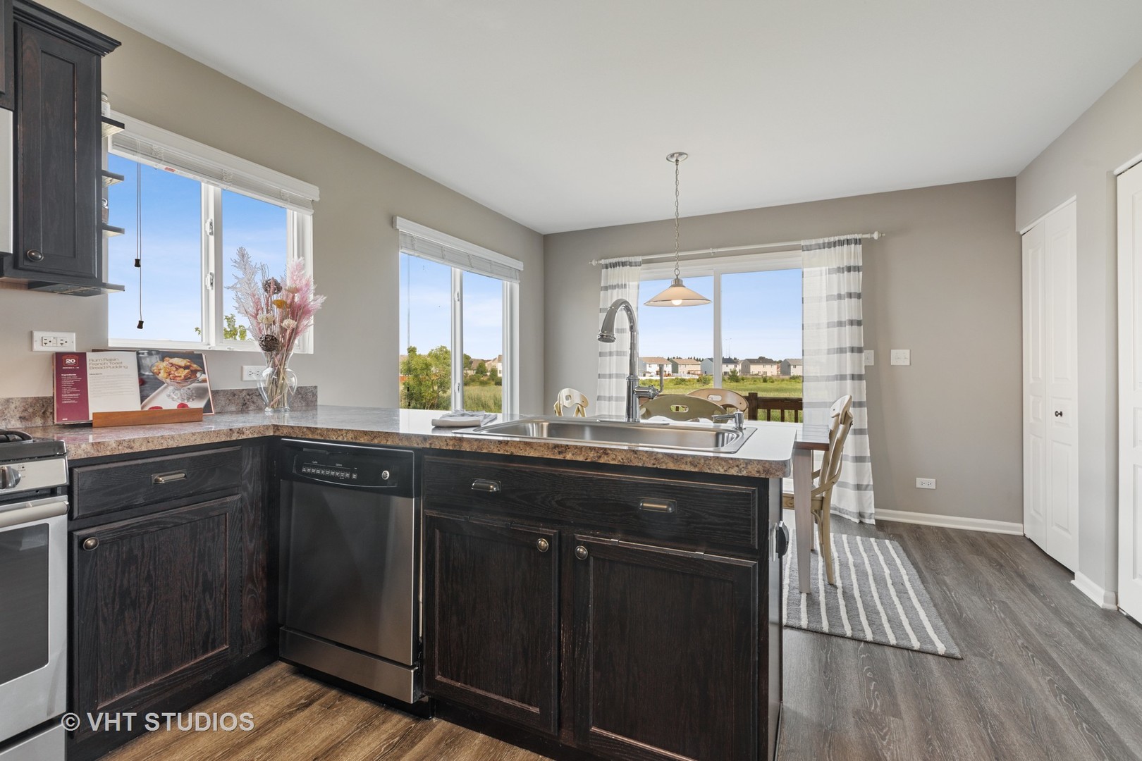1141 Piccolo Lane Volo, IL 60073 - Photo 7 of 29 a kitchen with a sink stove and cabinets