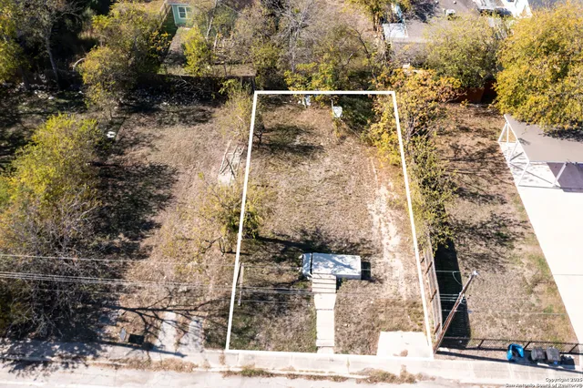a view of a glass door with a yard