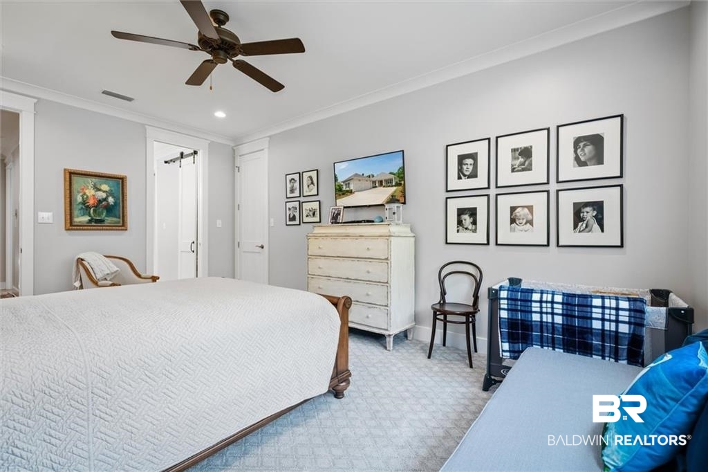 707 Cardamel Court Fairhope, AL 36532 - Photo 29 of 40 Bedroom with carpet, ceiling fan, and ornamental molding