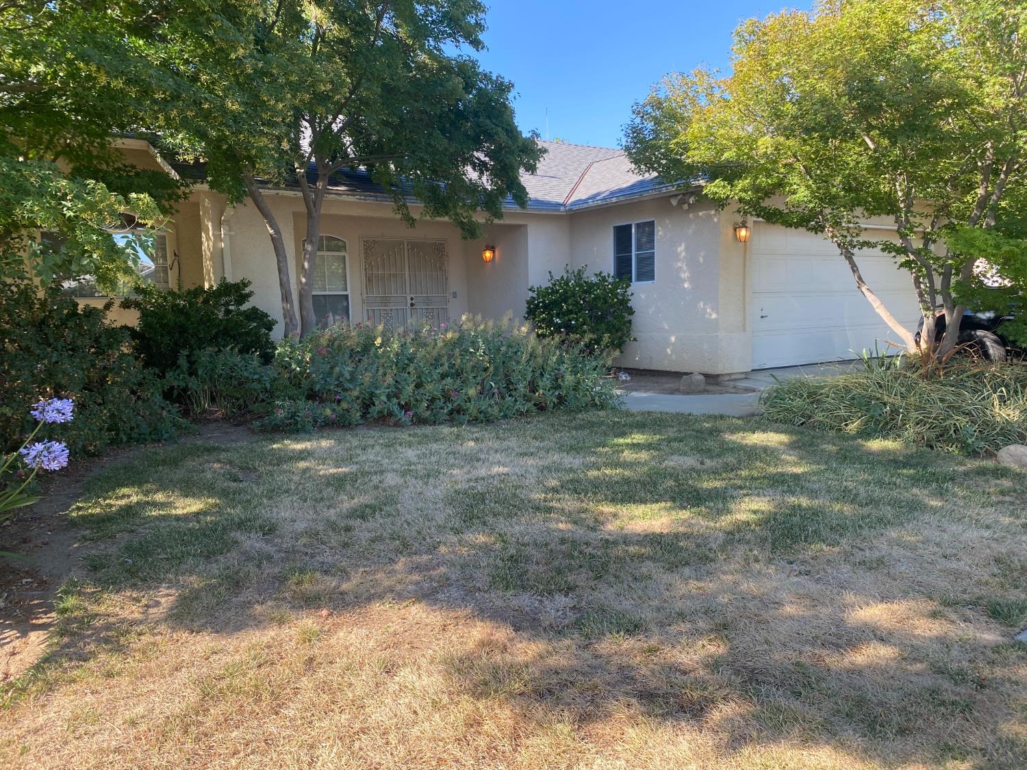 609 Merlot Avenue Madera, CA 93637 - Photo 1 of 45 a view of a house with a yard