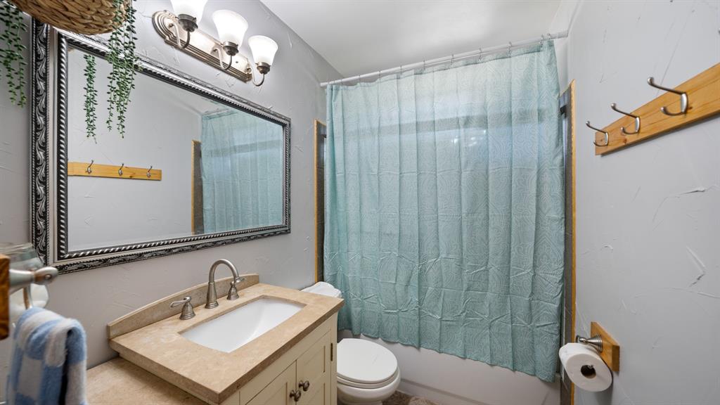 29080 Highway 19 Athens, TX 75752 - Photo 16 of 30 a bathroom with a sink vanity mirror and toilet