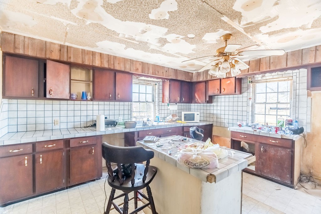 7560 Old Madisonville Road Hopkinsville, KY 42240 - Photo 20 of 31 a kitchen with a sink and cabinets