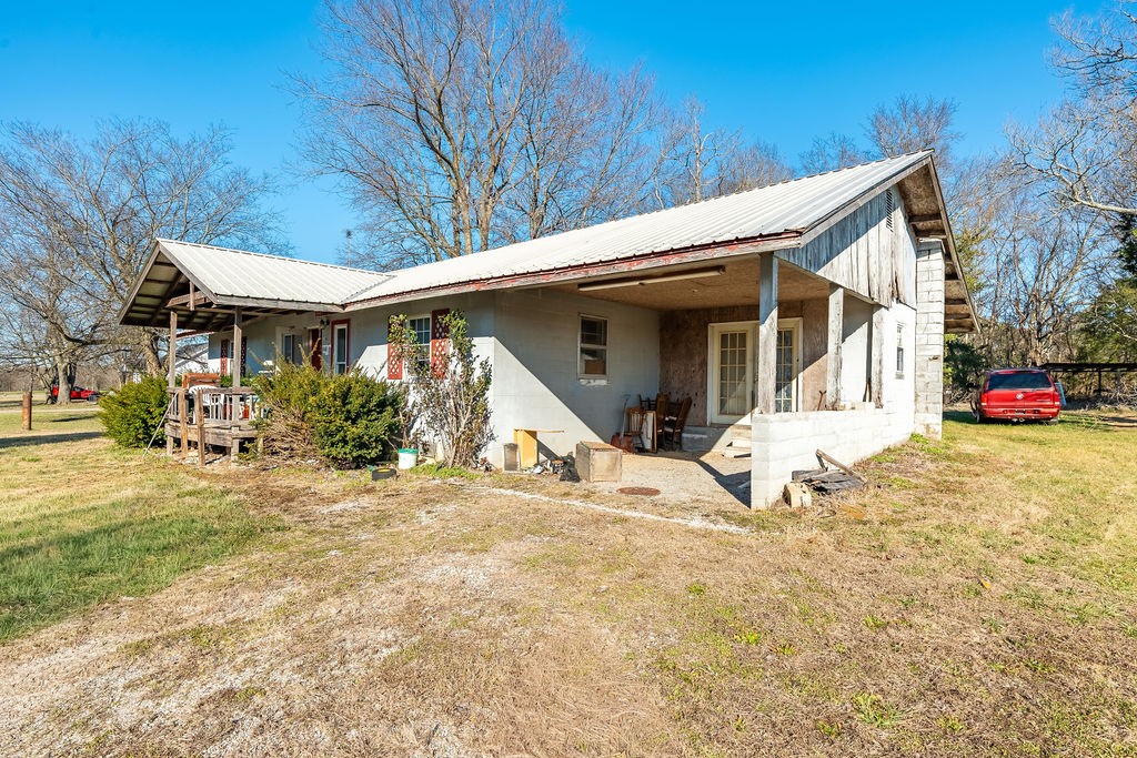 7560 Old Madisonville Road Hopkinsville, KY 42240 - Photo 24 of 31 a view of a house with a yard