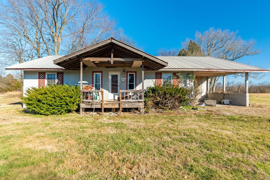 7560 Old Madisonville Road Hopkinsville, KY 42240 - Photo 25 of 31 a front view of a house with a yard